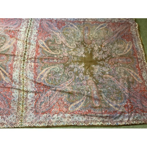 214 - Two Paisley throws/tablecloths both with damage and repairs. Two patterned throws/tablecloths. Embro... 