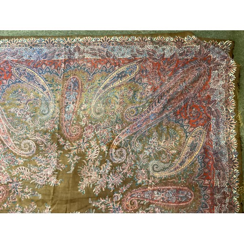 214 - Two Paisley throws/tablecloths both with damage and repairs. Two patterned throws/tablecloths. Embro... 