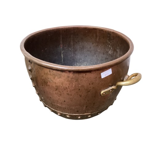 411 - A quantity of brass and copper wares, include large cauldron, teapot, a Victorian copper spirit kett... 