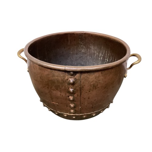 411 - A quantity of brass and copper wares, include large cauldron, teapot, a Victorian copper spirit kett... 