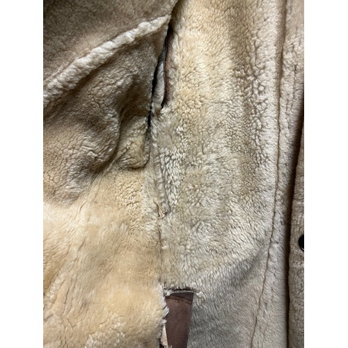 246 - Sheep skin leather coat, with marks and damage, see photos for details. size across inside back from... 