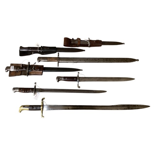 A collection of seven bayonets four with scabbards and some associated ...