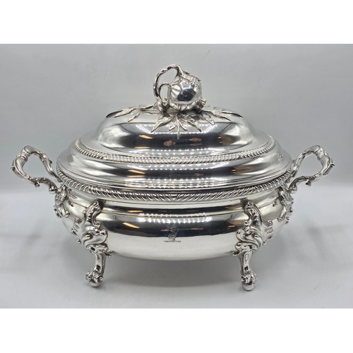2 - An Irish Silver lidded oval tureen with cast poppy finial,  loop handles on four scroll feet, 38 cm ... 