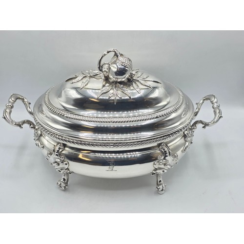 2 - An Irish Silver lidded oval tureen with cast poppy finial,  loop handles on four scroll feet, 38 cm ... 