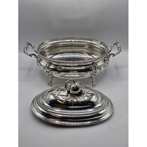 2 - An Irish Silver lidded oval tureen with cast poppy finial,  loop handles on four scroll feet, 38 cm ... 