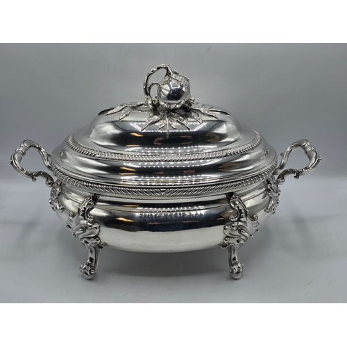 2 - An Irish Silver lidded oval tureen with cast poppy finial,  loop handles on four scroll feet, 38 cm ... 
