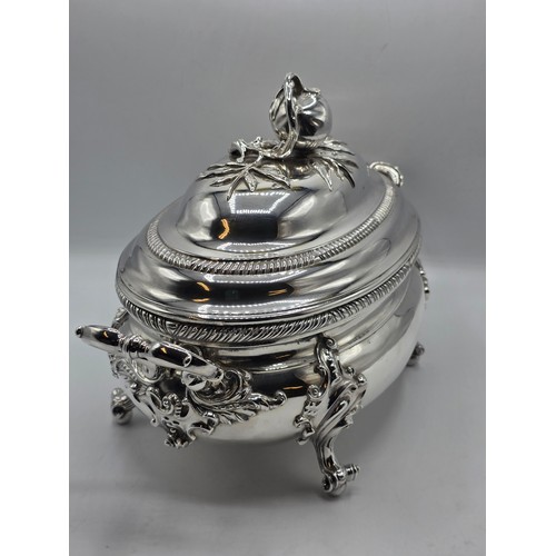 2 - An Irish Silver lidded oval tureen with cast poppy finial,  loop handles on four scroll feet, 38 cm ... 