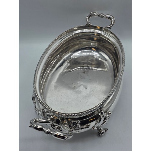 2 - An Irish Silver lidded oval tureen with cast poppy finial,  loop handles on four scroll feet, 38 cm ... 