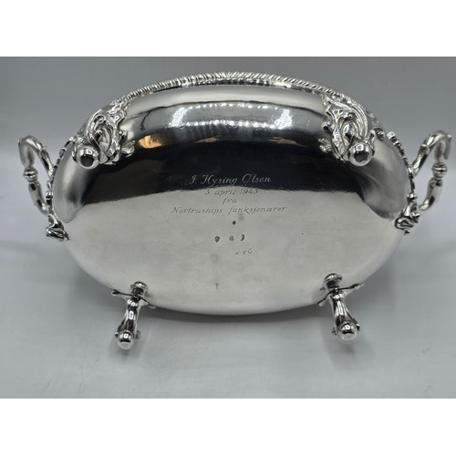 2 - An Irish Silver lidded oval tureen with cast poppy finial,  loop handles on four scroll feet, 38 cm ... 