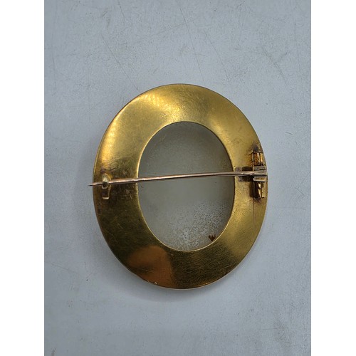 3 - Elena Pistrucci (1822-1886) An unmarked yellow metal hardstone cameo brooch with Greek key oval surr... 