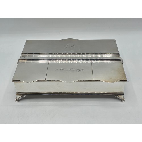 10 - A sterling silver inkwell desk tidy with two removable silver topped glass inkwells with articulated... 