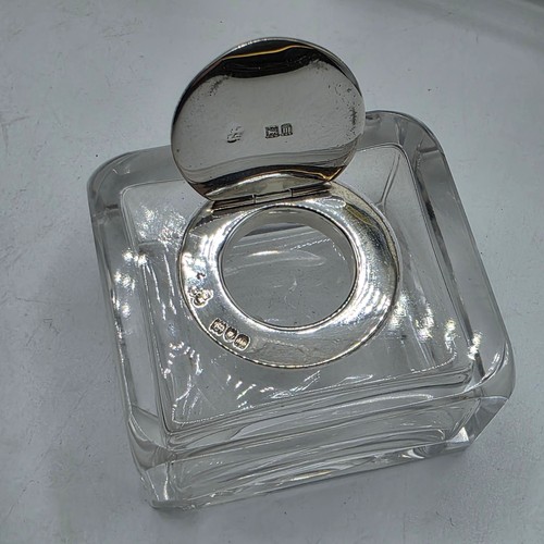 10 - A sterling silver inkwell desk tidy with two removable silver topped glass inkwells with articulated... 