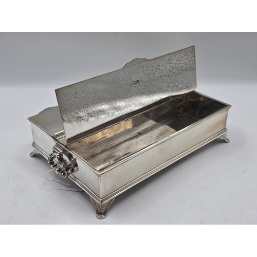 10 - A sterling silver inkwell desk tidy with two removable silver topped glass inkwells with articulated... 