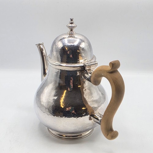 14 - A sterling silver hand planished tea pot, S J Phillips London 2000, gross weight 897 g