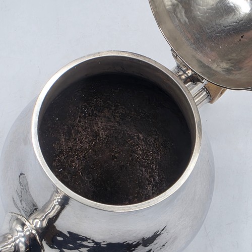 14 - A sterling silver hand planished tea pot, S J Phillips London 2000, gross weight 897 g