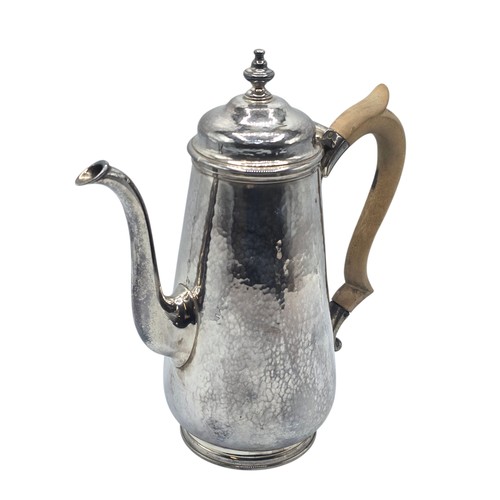 15 - A sterling silver hand planished coffee pot by S J Phillips London 2000, gross weight 911 g