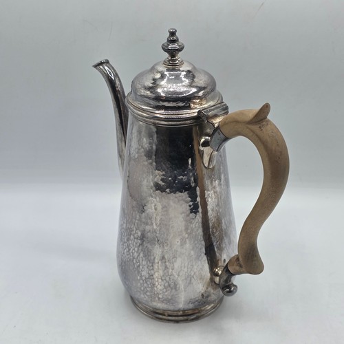15 - A sterling silver hand planished coffee pot by S J Phillips London 2000, gross weight 911 g