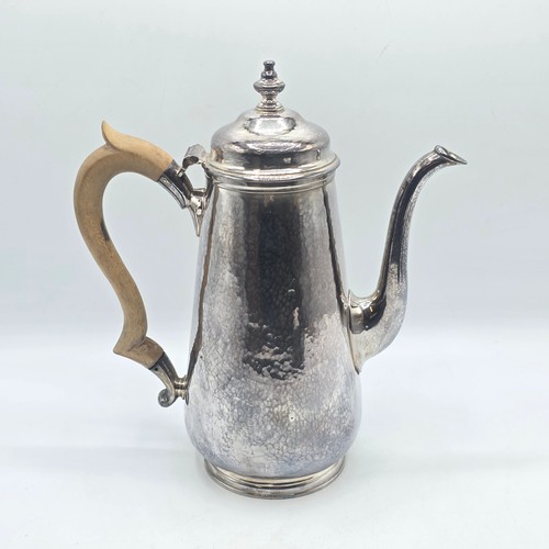 15 - A sterling silver hand planished coffee pot by S J Phillips London 2000, gross weight 911 g
