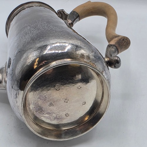 15 - A sterling silver hand planished coffee pot by S J Phillips London 2000, gross weight 911 g