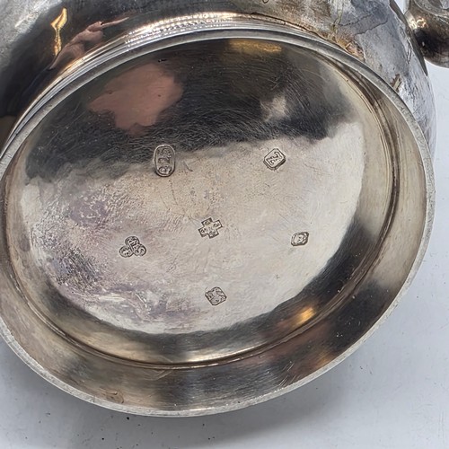 15 - A sterling silver hand planished coffee pot by S J Phillips London 2000, gross weight 911 g