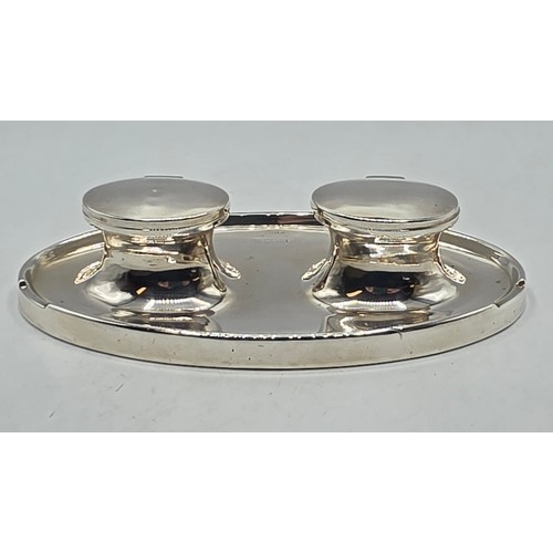 19 - A sterling silver capstan double ink well with weighted base, marks worn. Gross weight 690g.
