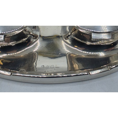 19 - A sterling silver capstan double ink well with weighted base, marks worn. Gross weight 690g.