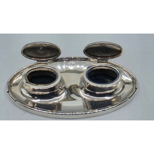 19 - A sterling silver capstan double ink well with weighted base, marks worn. Gross weight 690g.