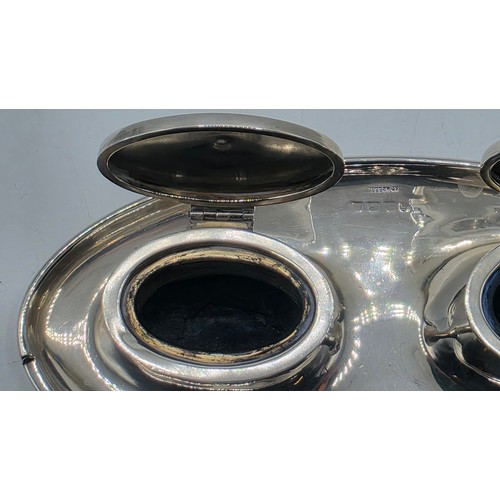 19 - A sterling silver capstan double ink well with weighted base, marks worn. Gross weight 690g.