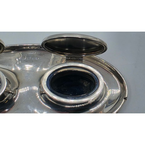 19 - A sterling silver capstan double ink well with weighted base, marks worn. Gross weight 690g.