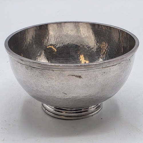 18 - Two matching sterling silver hand planished jugs together with matching hand planished sterling silv... 