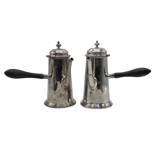 16 - A matched pair of sterling silver chocolate pots with ebonised handles, Martin Hall & Co.  Sheffield... 