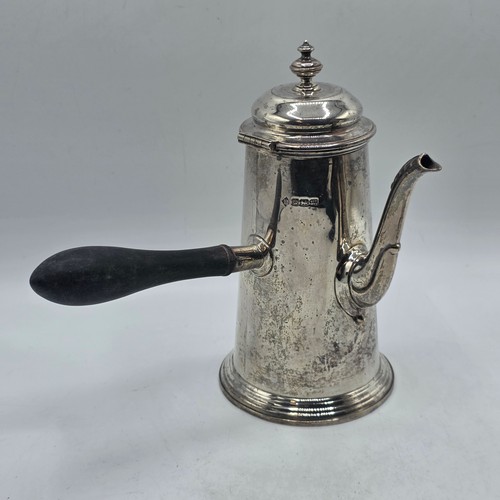 16 - A matched pair of sterling silver chocolate pots with ebonised handles, Martin Hall & Co.  Sheffield... 