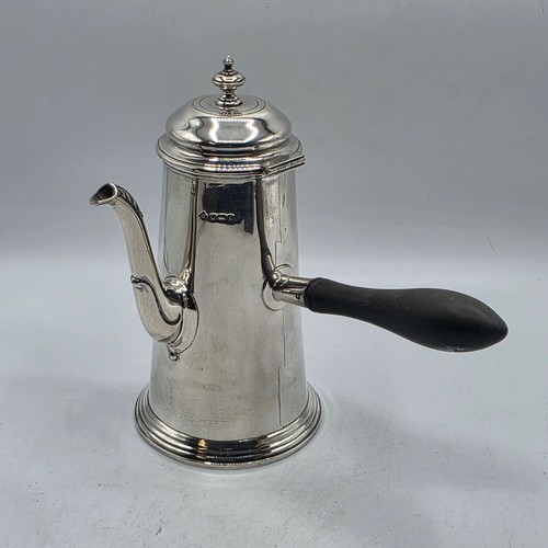 16 - A matched pair of sterling silver chocolate pots with ebonised handles, Martin Hall & Co.  Sheffield... 