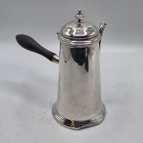 16 - A matched pair of sterling silver chocolate pots with ebonised handles, Martin Hall & Co.  Sheffield... 