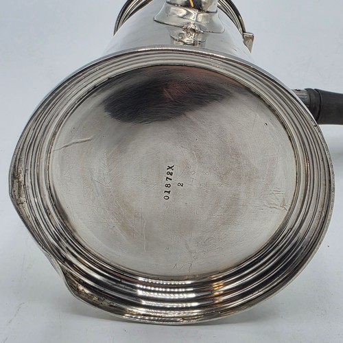 16 - A matched pair of sterling silver chocolate pots with ebonised handles, Martin Hall & Co.  Sheffield... 
