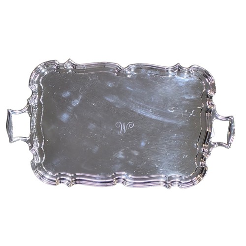 6 - A sterling silver oblong tray with cast handles 64 cm x 37 cm.  Barker Brothers Ltd Chester 1911.  2... 