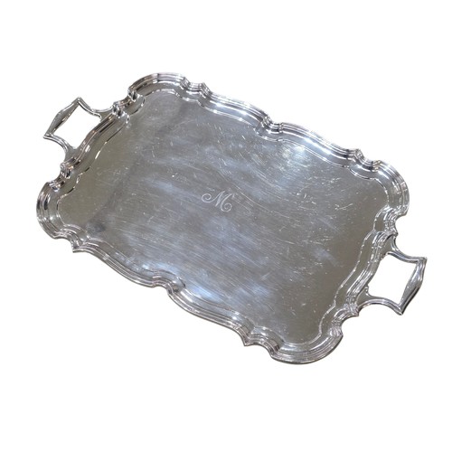 6 - A sterling silver oblong tray with cast handles 64 cm x 37 cm.  Barker Brothers Ltd Chester 1911.  2... 