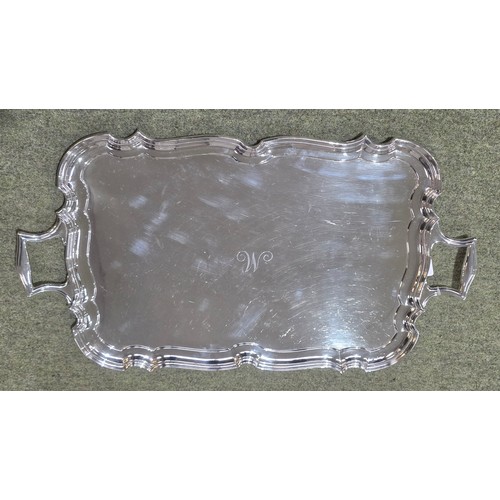 6 - A sterling silver oblong tray with cast handles 64 cm x 37 cm.  Barker Brothers Ltd Chester 1911.  2... 