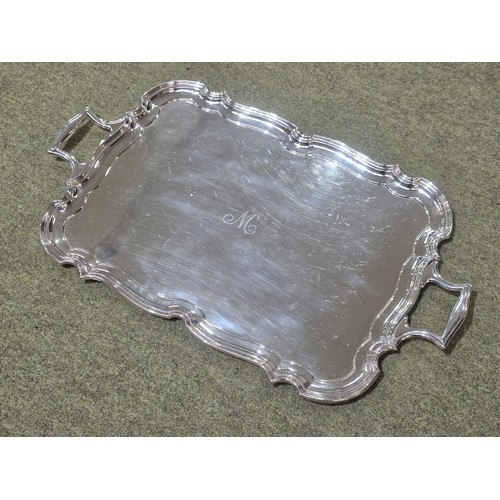 6 - A sterling silver oblong tray with cast handles 64 cm x 37 cm.  Barker Brothers Ltd Chester 1911.  2... 