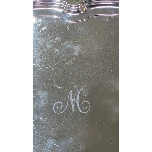 6 - A sterling silver oblong tray with cast handles 64 cm x 37 cm.  Barker Brothers Ltd Chester 1911.  2... 