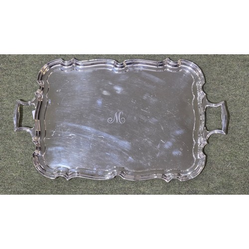 6 - A sterling silver oblong tray with cast handles 64 cm x 37 cm.  Barker Brothers Ltd Chester 1911.  2... 