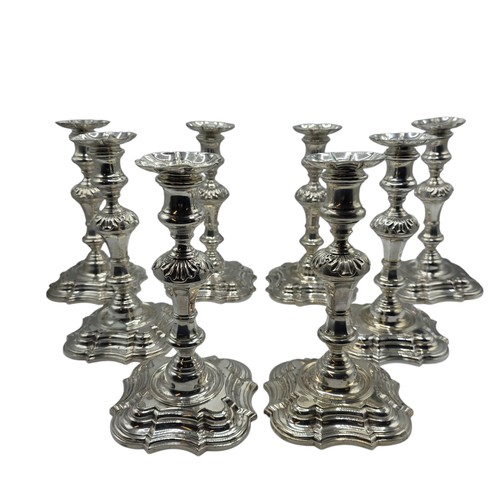 9 - A set of eight solid sterling silver table candlesticks, stepped square basis, S J Phillips London L... 