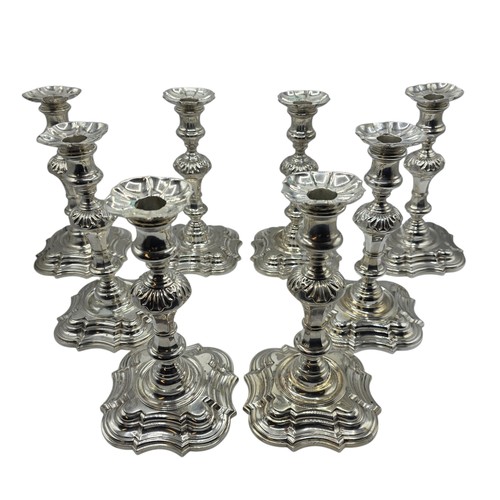 9 - A set of eight solid sterling silver table candlesticks, stepped square basis, S J Phillips London L... 
