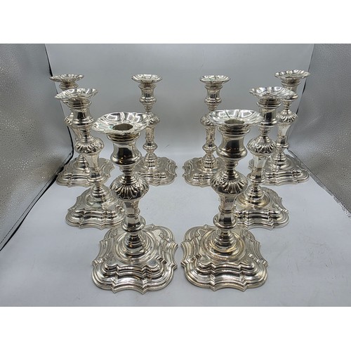 9 - A set of eight solid sterling silver table candlesticks, stepped square basis, S J Phillips London L... 