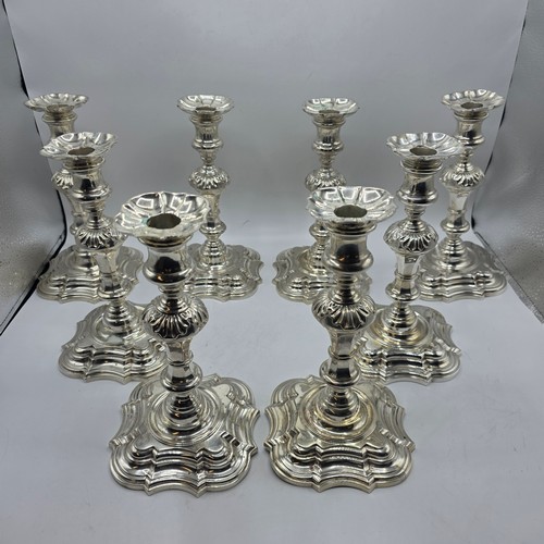 9 - A set of eight solid sterling silver table candlesticks, stepped square basis, S J Phillips London L... 