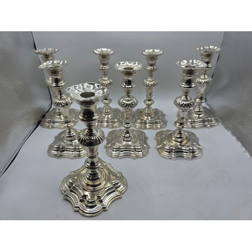 9 - A set of eight solid sterling silver table candlesticks, stepped square basis, S J Phillips London L... 