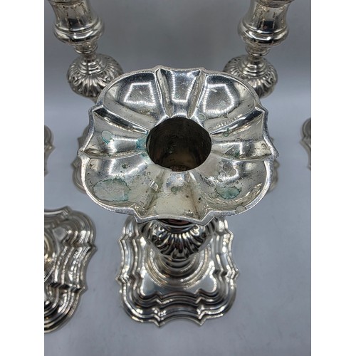 9 - A set of eight solid sterling silver table candlesticks, stepped square basis, S J Phillips London L... 