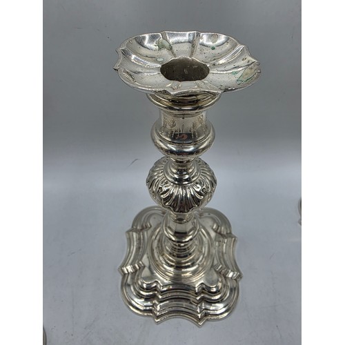 9 - A set of eight solid sterling silver table candlesticks, stepped square basis, S J Phillips London L... 