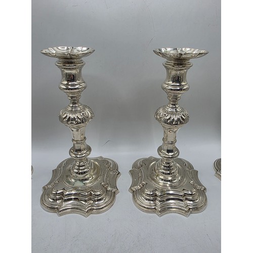 9 - A set of eight solid sterling silver table candlesticks, stepped square basis, S J Phillips London L... 