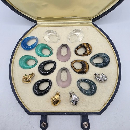 26 - An unmarked yellow and white metal diamond set metamorphic earing set in fitted felt lined case with... 